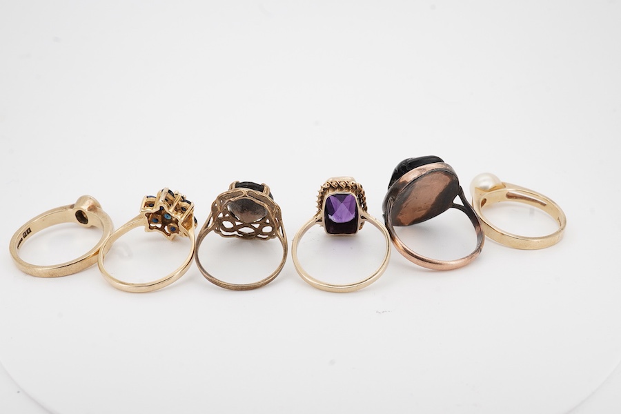 A collection of six gold rings